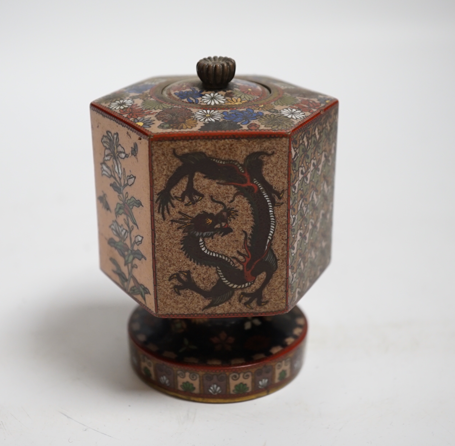 A Japanese hexagonal pedestal cloisonné enamel jar and cover, Meiji period, 10cm high